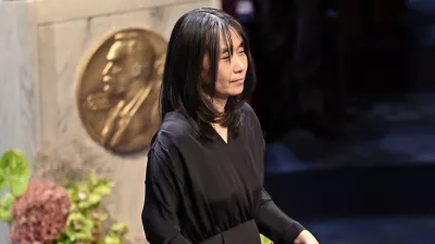 Nobel laureate in literature Han Kang holds her award during the Nobel Prize ceremony in Stockholm, Sweden, Tuesday, Dec. 10, 2024. (Jonas Ekstroemer/TT News Agency via AP)