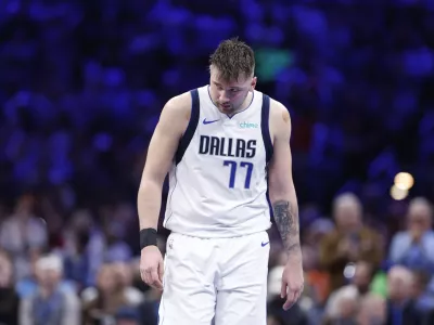 Dec 10, 2024; Oklahoma City, Oklahoma, USA; Dallas Mavericks guard Luka Doncic (77) walks down the court during a time out against the Oklahoma City Thunder during the second half at Paycom Center. Mandatory Credit: Alonzo Adams-Imagn Images