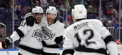 Dec 10, 2024; Elmont, New York, USA; Los Angeles Kings right wing Adrian Kempe (9) celebrates his goal against the New York Islanders with center Anze Kopitar (11) and left wing Trevor Moore (12) during the first period at UBS Arena. Mandatory Credit: Brad Penner-Imagn Images