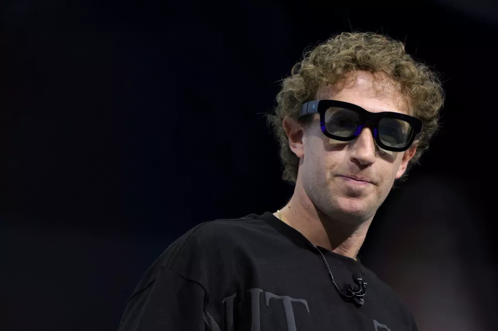 Meta CEO Mark Zuckerberg tries on Orion AR glasses at the Meta Connect annual event at the company's headquarters in Menlo Park, California, U.S., September 25, 2024. REUTERS/Manuel Orbegozo  TPX IMAGES OF THE DAY