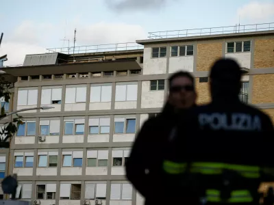 Police officers stand outside Gemelli Hospital where Pope Francis attends a previously scheduled check-up, in Rome, Italy March 29, 2023. REUTERS/Guglielmo Mangiapane