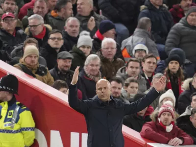 Liverpool's manager Arne Slot reacts during the English Premier League soccer match between Liverpool and Fulham, at Anfield stadium in Liverpool, England, Saturday, Dec. 14, 2024. (AP Photo/Jon Super)