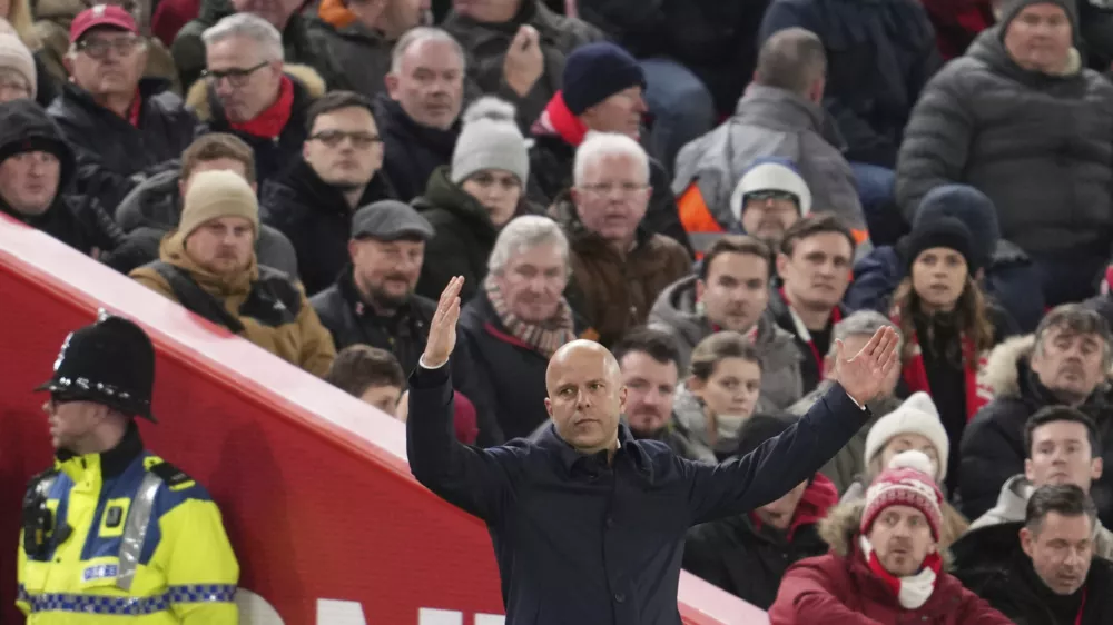 Liverpool's manager Arne Slot reacts during the English Premier League soccer match between Liverpool and Fulham, at Anfield stadium in Liverpool, England, Saturday, Dec. 14, 2024. (AP Photo/Jon Super)