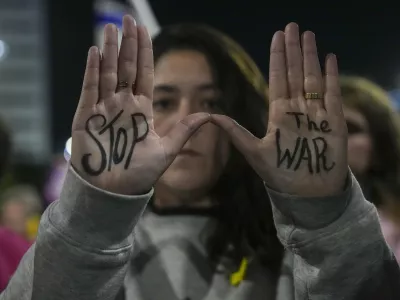 Israelis protest against Prime Minister Benjamin Netanyahu's government and call for the release of hostages held in the Gaza Strip by the Hamas militant group, in Tel Aviv, Israel, Saturday, Dec. 14, 2024. (AP Photo/Tsafrir Abayov)