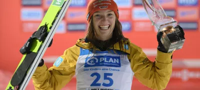 FILED - 03 February 2024, Hesse, Willingen: Katharina Schmid from Germany celebrates at the award ceremony of the women's Nordic skiing during the Ski Jumping World Cup. Schmid extended her overall lead after winning a women's normal hill World Cup ski-jumping event in the 2022 Winter Olympic venue of Zhangjiakou, China on 13 December. Photo: Swen Pförtner/dpa