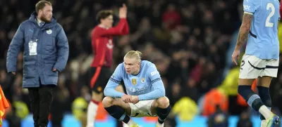 Manchester City's Erling Haaland, centre, reacts disappointed after the English Premier League soccer match between Manchester City and Manchester United at the Etihad Stadium in Manchester, Sunday, Dec. 15, 2024. (AP Photo/Dave Thompson)