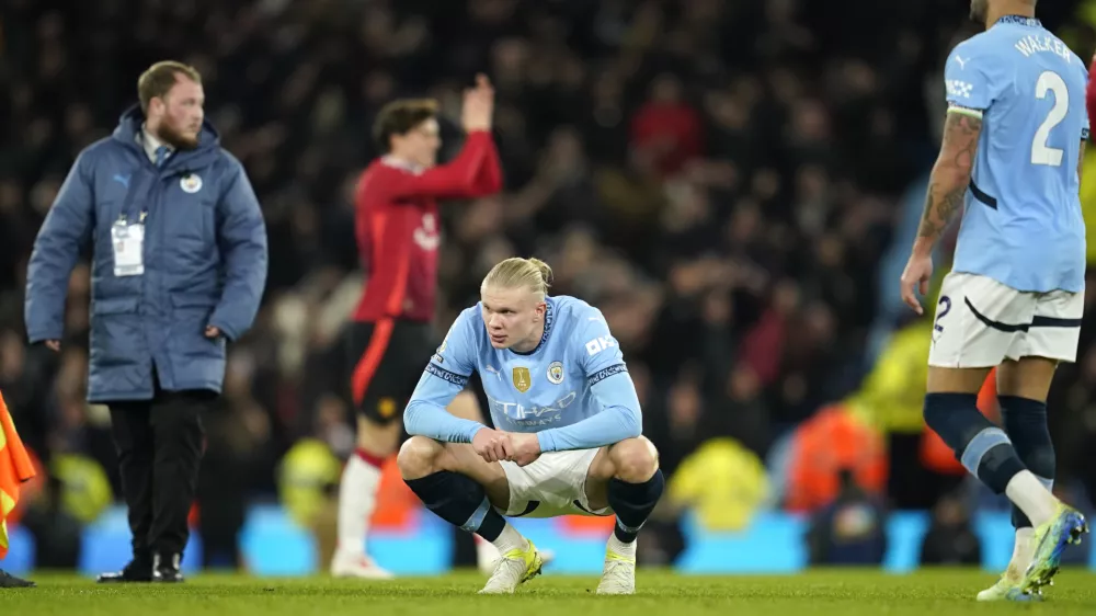 Manchester City's Erling Haaland, centre, reacts disappointed after the English Premier League soccer match between Manchester City and Manchester United at the Etihad Stadium in Manchester, Sunday, Dec. 15, 2024. (AP Photo/Dave Thompson)