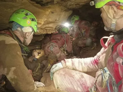 This image released Monday, Dec. 16, 2024 by the Italian Soccorso Alpino (Alpine Rescue) shows the rescue operation of Ottavia Piana, a caver blocked in a deep inside the Bueno Fonteno cave, near Bergamo, Italy, after falling some 5 meters (16 feet) Saturday evening during an expedition. (Soccorso Alpino via AP)