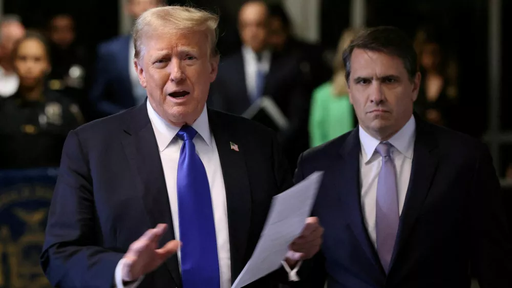 FILE PHOTO: Former U.S. President Donald Trump, alongside his attorney Todd Blanche, speaks to the media as he arrives for his criminal trial for allegedly covering up hush money payments at Manhattan Criminal Court on May 30, 2024 in New York City. Michael M. Santiago/Pool via REUTERS/File Photo