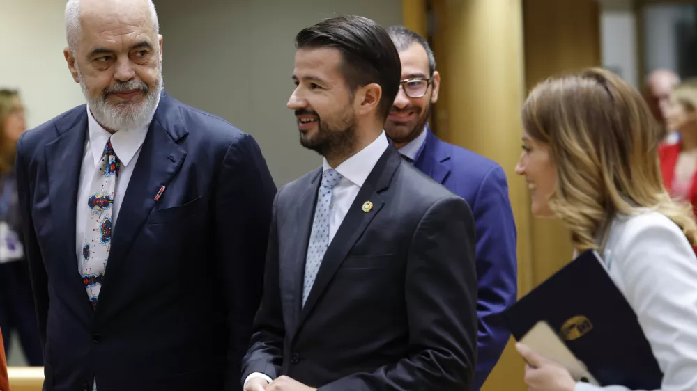 From left, Albania's Prime Minister Edi Rama, Montenegro's President Jakov Milatovic and European Parliament President Roberta Metsola arrive for a round table meeting during an EU-Western Balkans summit in Brussels, Wednesday, Dec. 18, 2024. (AP Photo/Geert Vanden Wijngaert)