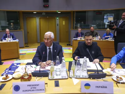 Ukraine's President Volodymyr Zelenskyy, right, and European Council President Antonio Costa attend a round table meeting during an EU summit in Brussels on Thursday, Dec. 19, 2024. (Johanna Geron, Pool Photo via AP)