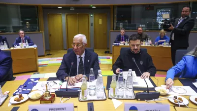 Ukraine's President Volodymyr Zelenskyy, right, and European Council President Antonio Costa attend a round table meeting during an EU summit in Brussels on Thursday, Dec. 19, 2024. (Johanna Geron, Pool Photo via AP)