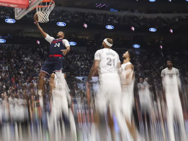 Dec 19, 2024; Dallas, Texas, USA; (Editor's Note: A filter was used in the creation of this image.) LA Clippers guard Norman Powell (24) shoots past Dallas Mavericks center Daniel Gafford (21) during the second half at American Airlines Center. Mandatory Credit: Kevin Jairaj-Imagn Images