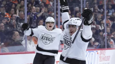 Los Angeles Kings' Anze Kopitar, right, celebrates after scoring a goal during the third period of an NHL hockey game against the Philadelphia Flyers, Thursday, Dec. 19, 2024, in Philadelphia. (AP Photo/Matt Slocum)