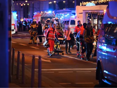 20 December 2024, Saxony-Anhalt, Magdeburg: Emergency services, police and firefighters are on duty to help injured people after a car drove into the Christmas market in Magdeburg. Photo: Heiko Rebsch/dpa - ATTENTION: individual(s) has/have been pixelated for legal reasons