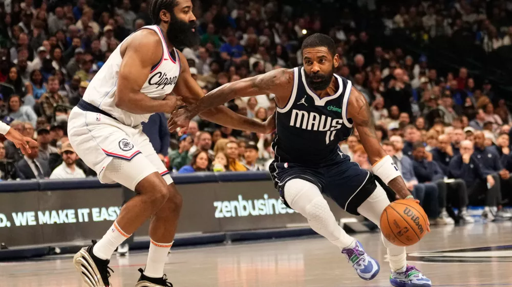 Dec 21, 2024; Dallas, Texas, USA; Dallas Mavericks guard Kyrie Irving (11) drives to the basket as LA Clippers guard James Harden (1) defends during the second half at American Airlines Center. Mandatory Credit: Chris Jones-Imagn Images