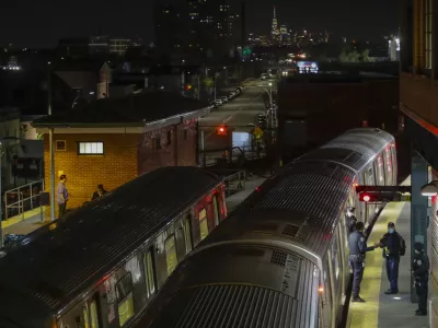 FILE - New York Police officers clear a train at the Coney Island Stillwell Avenue Terminal, May 5, 2020, in the Brooklyn borough of New York. (AP Photo/Frank Franklin II, file)