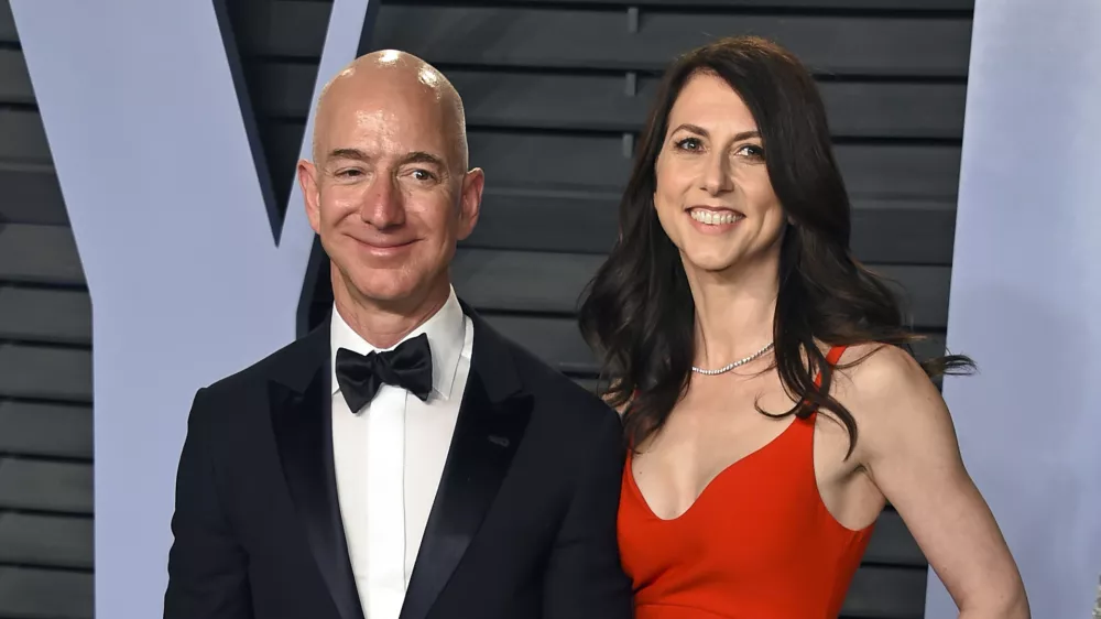 ﻿FILE - In this March 4, 2018 file photo, Jeff Bezos and wife MacKenzie Bezos arrive at the Vanity Fair Oscar Party in Beverly Hills, Calif. The founder of Amazon and his wife have made their largest political donation to date, giving $10 million to With Honor, a nonpartisan political-action committee devoted to helping military veterans running for Congress. (Photo by Evan Agostini/Invision/AP, File)