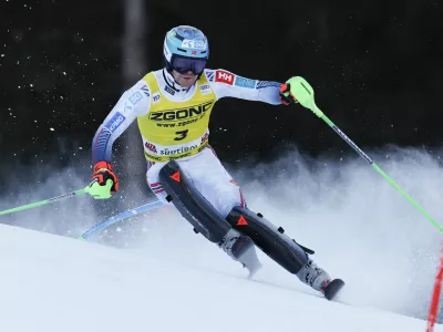 Norway's Timon Haugan speeds down the course during an alpine ski, men's World Cup slalom, in Alta Badia, Italy, Monday, Dec. 23, 2024. (AP Photo/Alessandro Trovati)