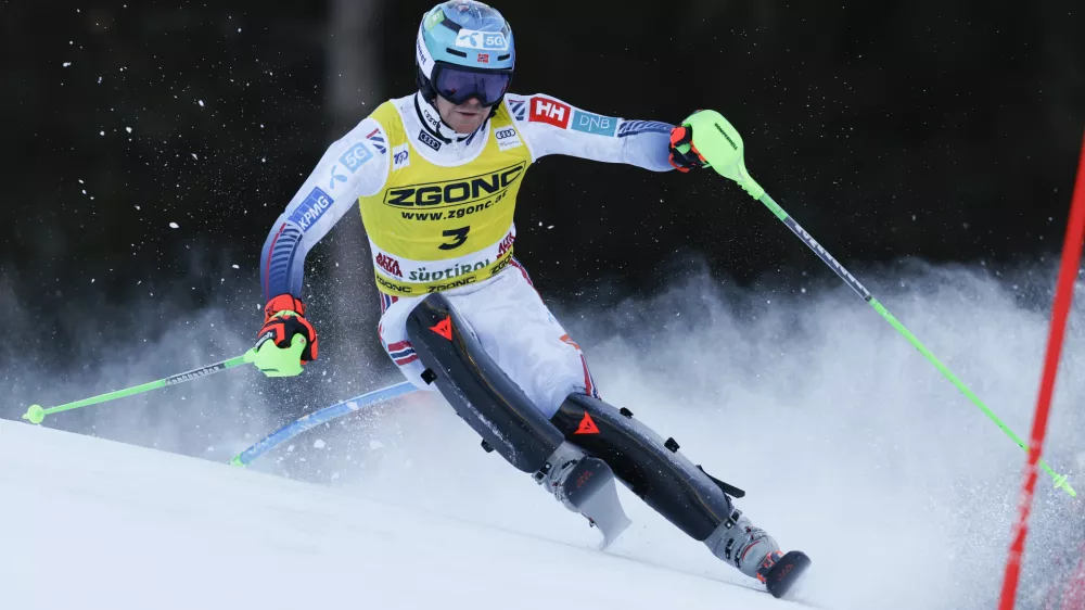 Norway's Timon Haugan speeds down the course during an alpine ski, men's World Cup slalom, in Alta Badia, Italy, Monday, Dec. 23, 2024. (AP Photo/Alessandro Trovati)