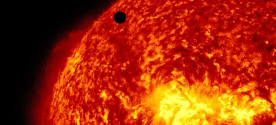 This image provided by NASA shows the Solar Dynamic Observatory's ultra-high definition view of Venus, black dot at top center, passing in front of the sun on Tuesday, June 5, 2012. The next transit of Venus won't be for another 105 years. (AP Photo/NASA/Solar Dynamic Observatory)