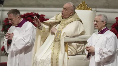 Pope Francis presides over the Christmas Eve Mass in St. Peter's Basilica at The Vatican, Tuesday, Dec. 24, 2024, after opening the basilica's holy door marking the start of the Catholic jubilar year 2025. (AP Photo/Andrew Medichini)