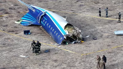 A drone view shows emergency specialists working at the crash site of an Azerbaijan Airlines passenger plane near the city of Aktau, Kazakhstan December 25, 2024. REUTERS/Azamat Sarsenbayev   TPX IMAGES OF THE DAY