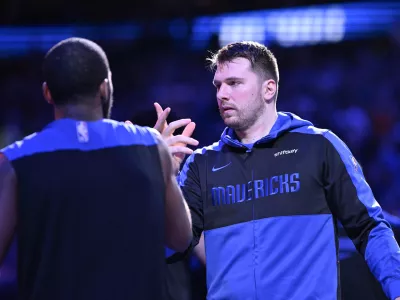 Dec 25, 2024; Dallas, Texas, USA; Dallas Mavericks guard Kyrie Irving (11) greets guard Luka Doncic (77) before the game against the Minnesota Timberwolves at the American Airlines Center. Mandatory Credit: Jerome Miron-Imagn Images