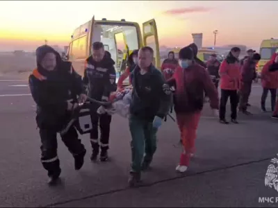 In this image released by the Russian Emergency Ministry Press Service, rescuers carry a wounded passenger near the Kazakhstani city of Aktau, Thursday, Dec. 26, 2024, after a plane of Azerbaijani Airline crashed. (Russian Emergency Ministry Press Service via AP)