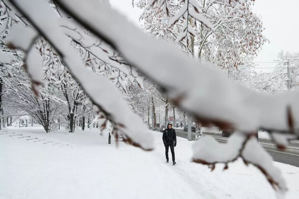 A man walks on the street during snowstorm in Sarajevo, Bosnia and Herzegovina, December 24, 2024.REUTERS/Amel Emric