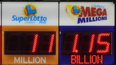 A sign advertising the estimated .15 billion Mega Millions jackpot, right, is displayed at Rossi's Deli in San Francisco, Thursday, Dec. 26, 2024. (AP Photo/Jeff Chiu)