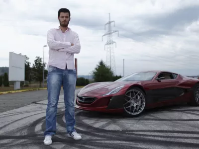 ﻿Mate Rimac owner of Rimac Automobili poses with the Concept One car in Zagreb August 31, 2012. Croatian concept car manufacturer Rimac Automobili based near Zagreb prepares to unveil a prototype of their Concept One electric supercar at the upcoming Salon Privé car show in London in early September.The Concept One has a carbon fiber body an electric motor powering each wheel, and can produce 1,088 horse powers, capable of achieving top speed of around 305 kmh (190 mph) with a range of 600 kilometres (373 miles), making it the world's fastest electric car. Costing around  million each, only 13 of these high-end electric cars are expected to be produced per year. Picture taken August 31, 2012. REUTERS/Antonio Bronic (CROATIA - Tags: TRANSPORT BUSINESS) - RTR37CTI