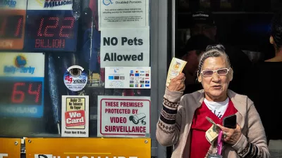 Diana Ramirez shows off her lottery tickets she bought at Joe's Service Center on Friday, Dec. 27, 2024 in Altadena, Calif. In 2022, the location had sold a .04 billion Powerball ticket. (AP Photo/Richard Vogel)