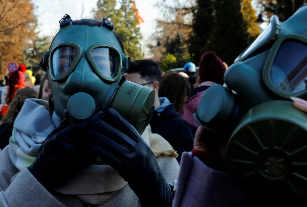 A woman wearing a gas mask protests to tackle air pollution in Skopje, North Macedonia December 28, 2024. REUTERS/Ognen Teofilovski