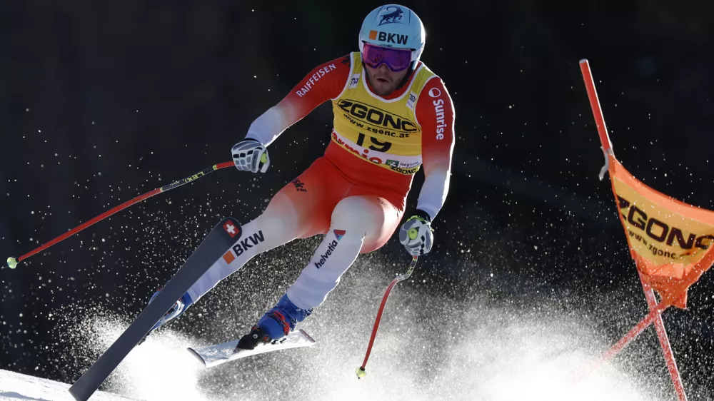 Switzerland's Alexis Monney speeds down the course during an alpine ski, men's World Cup downhill race, in Bormio, Italy, Saturday, Dec. 28, 2024. (AP Photo/Gabriele Facciotti)