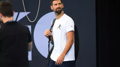 28 December 2024, Australia, Brisbane: Serbian tennis player Novak Djokovic arrives to a practice session prior to the Brisbane International at Queensland Tennis Centre in Brisbane. Photo: Jono Searle/AAP/dpa