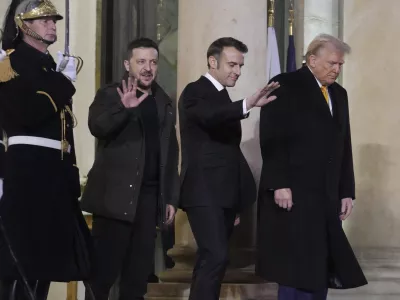 French President Emmanuel Macron, center, President-elect Donald Trump, right, and Ukraine's President Volodymyr Zelenskyy leave after their meeting at the Elysee Palace, Saturday, Dec. 7, 2024 in Paris. (AP Photo/Michel Euler)