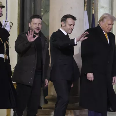 French President Emmanuel Macron, center, President-elect Donald Trump, right, and Ukraine's President Volodymyr Zelenskyy leave after their meeting at the Elysee Palace, Saturday, Dec. 7, 2024 in Paris. (AP Photo/Michel Euler)