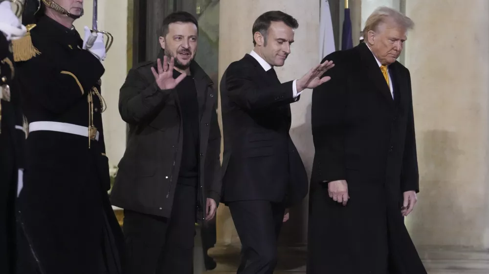 French President Emmanuel Macron, center, President-elect Donald Trump, right, and Ukraine's President Volodymyr Zelenskyy leave after their meeting at the Elysee Palace, Saturday, Dec. 7, 2024 in Paris. (AP Photo/Michel Euler)