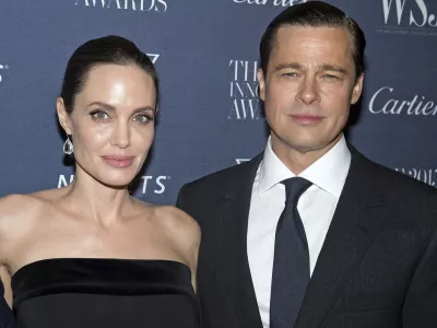 FILE - Angelina Jolie Pitt and Brad Pitt pose for a photo at the WSJ Magazine Innovator Awards 2015 at The Museum of Modern Art in New York, on Nov. 4, 2015. (Photo by Charles Sykes/Invision/AP, File)