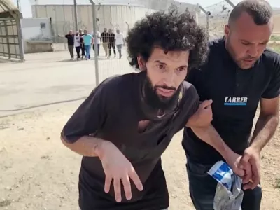 Palestinian prisoner Moazaz Obaiyat, released from Israeli jail, walks near Hebron in the Israeli-occupied West Bank, July 8, 2024 in this screengrab obtained from video. Reuters TV/via REUTERS