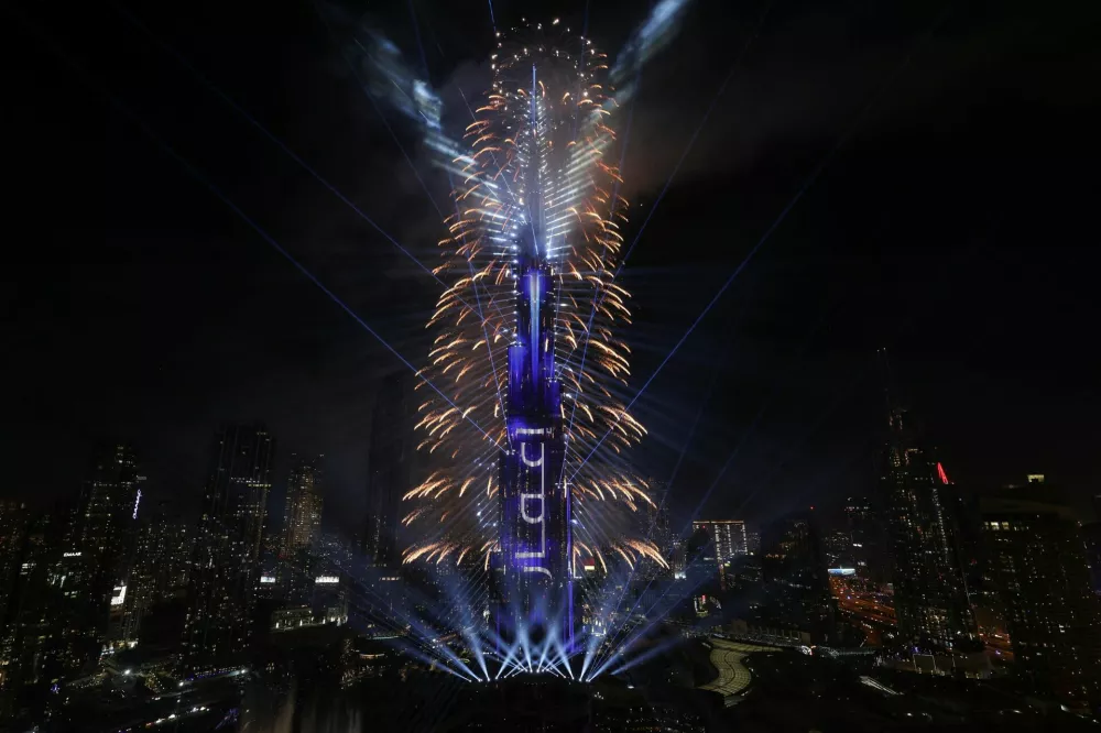 Fireworks explode over the Burj Khalifa, the tallest building in the world, during the New Year's celebration in Dubai, United Arab Emirates, January 1, 2025. REUTERS/Amr Alfiky