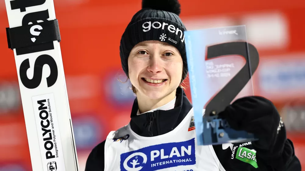 31 December 2024, Bavaria, Garmisch-Partenkirchen: Slovenia's Ski jumper Nika Prevc celebrates at the award ceremony after winning the women's large hill 2nd round of the ski jumping Two Nights Tour. Photo: Daniel Karmann/dpa