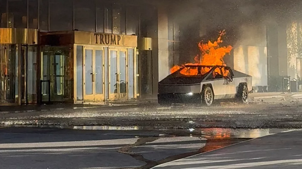 Flames rise from a Tesla Cybertruck after it exploded outside the Trump International Hotel Las Vegas, in Las Vegas, Nevada, U.S., January 1, 2025 in this screengrab taken from a social media video. Alcides Antunes/via REUTERS THIS IMAGE HAS BEEN SUPPLIED BY A THIRD PARTY. MANDATORY CREDIT. THIS PICTURE WAS PROCESSED BY REUTERS TO ENHANCE QUALITY. AN UNPROCESSED VERSION HAS BEEN PROVIDED SEPARATELY.   TPX IMAGES OF THE DAY