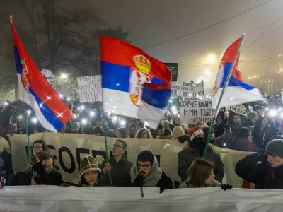 Students hold up their phones with flashlights during a New Year's Eve protest under the slogan 'There is no New Year - you still owe us for last one' organised against government policies and corruption, which they blame for the deaths of the victims in the Novi Sad railway station disaster in November, in Belgrade, Serbia, December 31, 2024. REUTERS/Djordje Kojadinovic