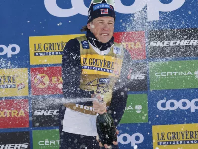 The winner Norway's Johannes Høsflot Klæbo celebrates after the 20km men's skiathlon classic race of the Tour de Ski cross country, in Val di Fiemme, Italy, Saturday, Jan. 4, 2025. (AP Photo/Alessandro Trovati)