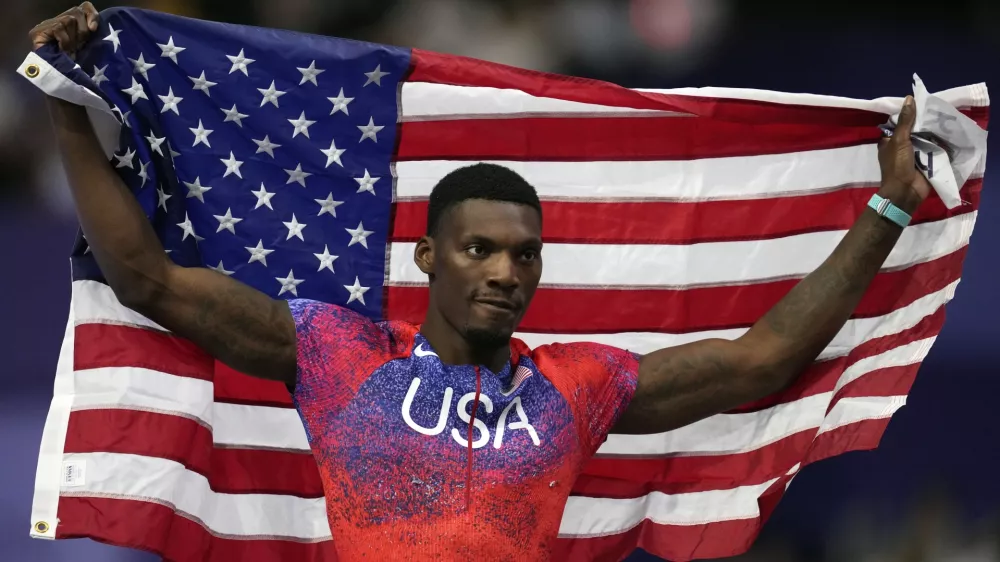 FILE - Fred Kerley, of the United States, poses after winning the bronze medal in the men's 100 meters final at the 2024 Summer Olympics, Sunday, Aug. 4, 2024, in Saint-Denis, France. (AP Photo/Ashley Landis, File)