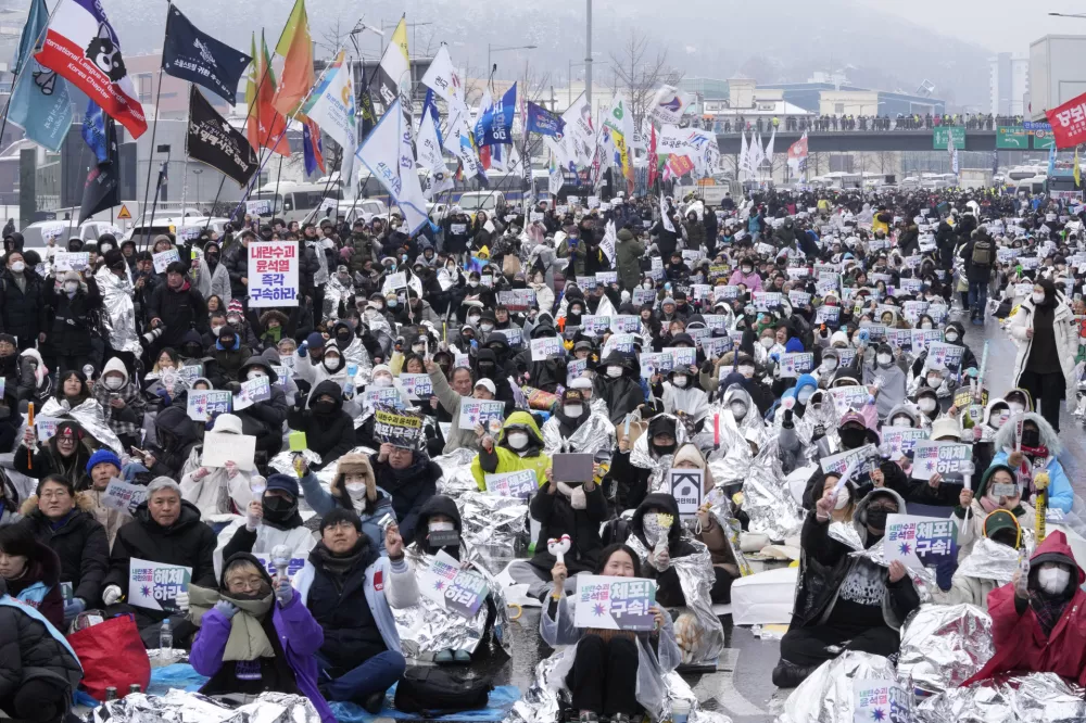 Protesters stage a rally demanding the arrest of impeached South Korean President Yoon Suk Yeol near the presidential residence in Seoul, South Korea, Sunday, Jan. 5, 2025. (AP Photo/Ahn Young-joon)