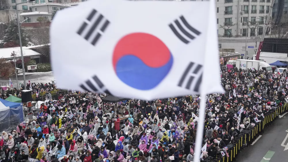 Supporters of impeached South Korean President Yoon Suk Yeol stage a rally to oppose his impeachment near the presidential residence in Seoul, South Korea, Sunday, Jan. 5, 2025. (AP Photo/Ahn Young-joon)