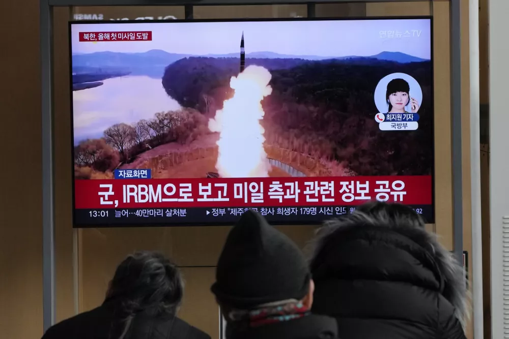 A TV screen shows a file image of North Korea's missile launch during a news program at Seoul Railway Station in Seoul, South Korea, Monday, Jan. 6, 2025. (AP Photo/Ahn Young-joon)